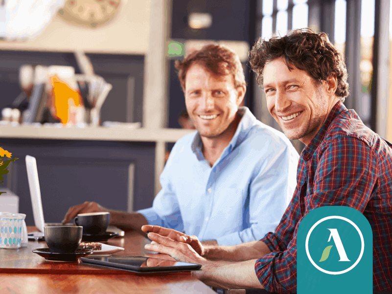 Two men meet over coffee